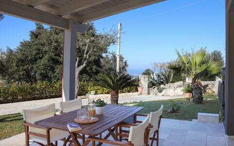 Villa Don Sante In Locorotondo Puglia: Fabriek, Tafel, Meubilair, Eigendom, Lucht, Stoel, Azure, Schaduw, Verlichting, Boom
