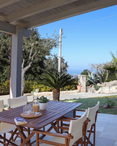 Villa Don Sante In Locorotondo Puglia: Fabriek, Tafel, Meubilair, Eigendom, Lucht, Stoel, Azure, Schaduw, Verlichting, Boom